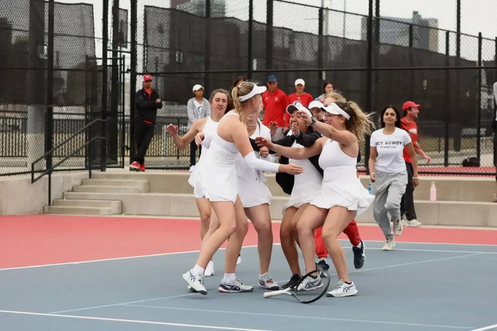 Image shows female tennis players celebrating